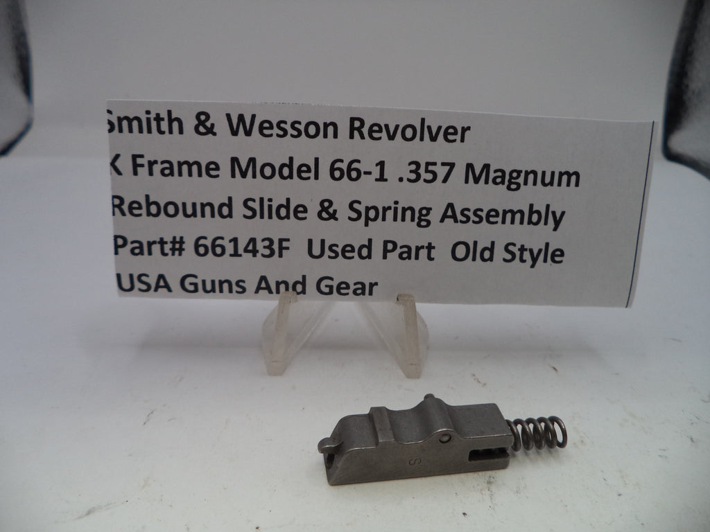 Smith & Wesson revolver slide and spring assembly with a label on a white background