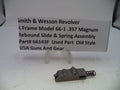 Smith & Wesson revolver slide and spring assembly with a label on a white background