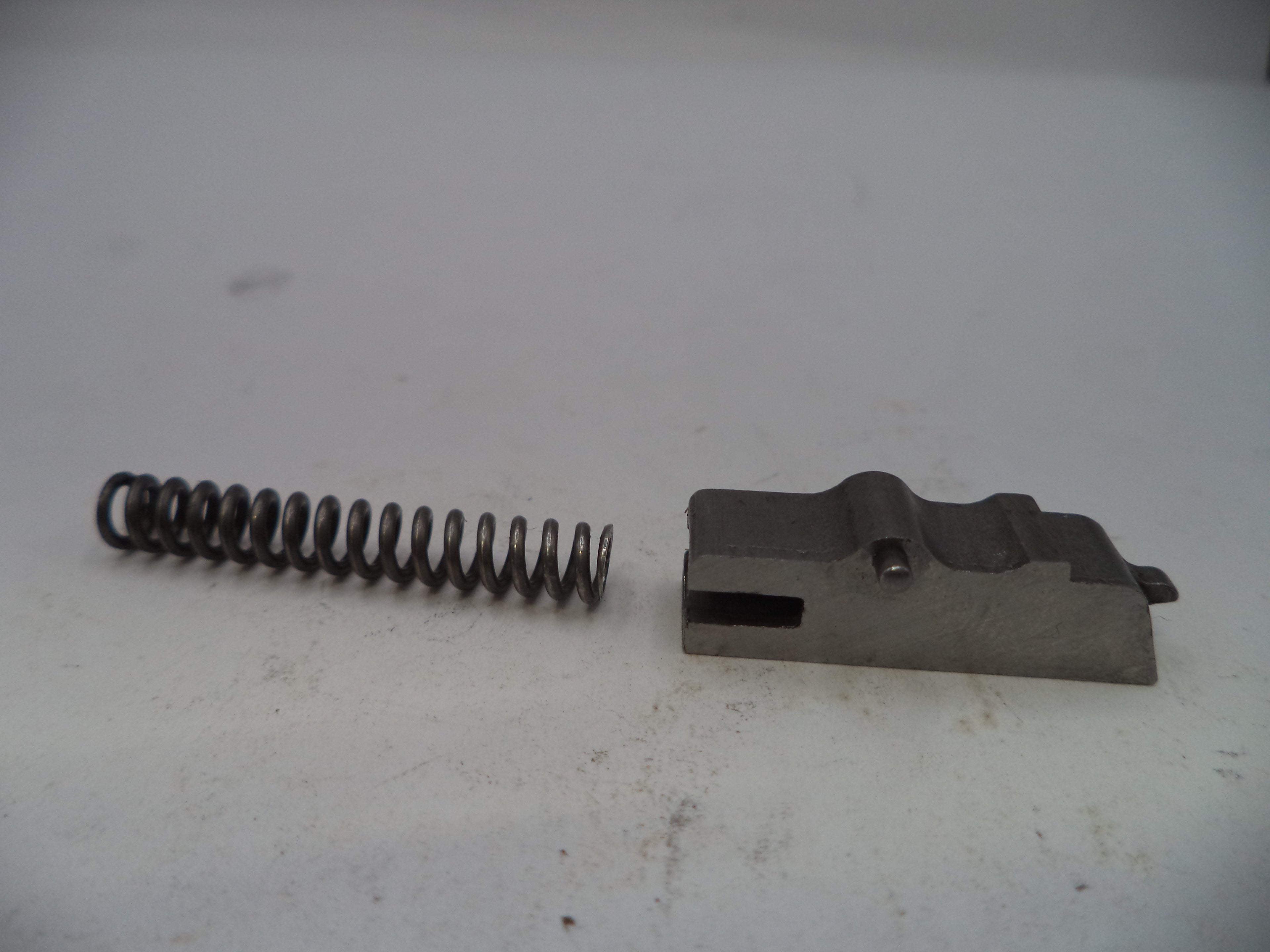 Metal spring and metal component on a white background
