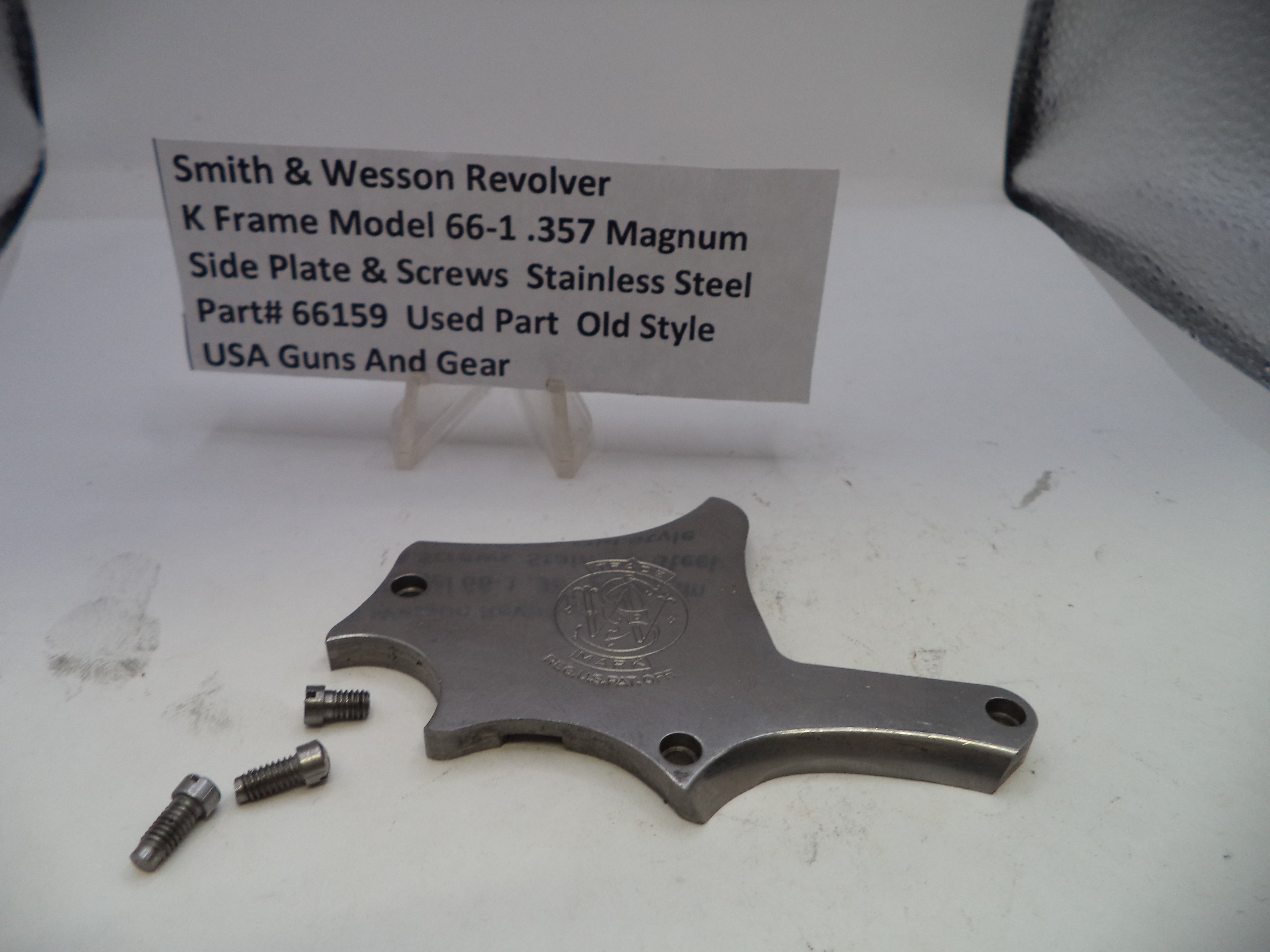 Smith & Wesson revolver K Frame Model 66-1 .357 Magnum side plate and screws on a white background with a label.
