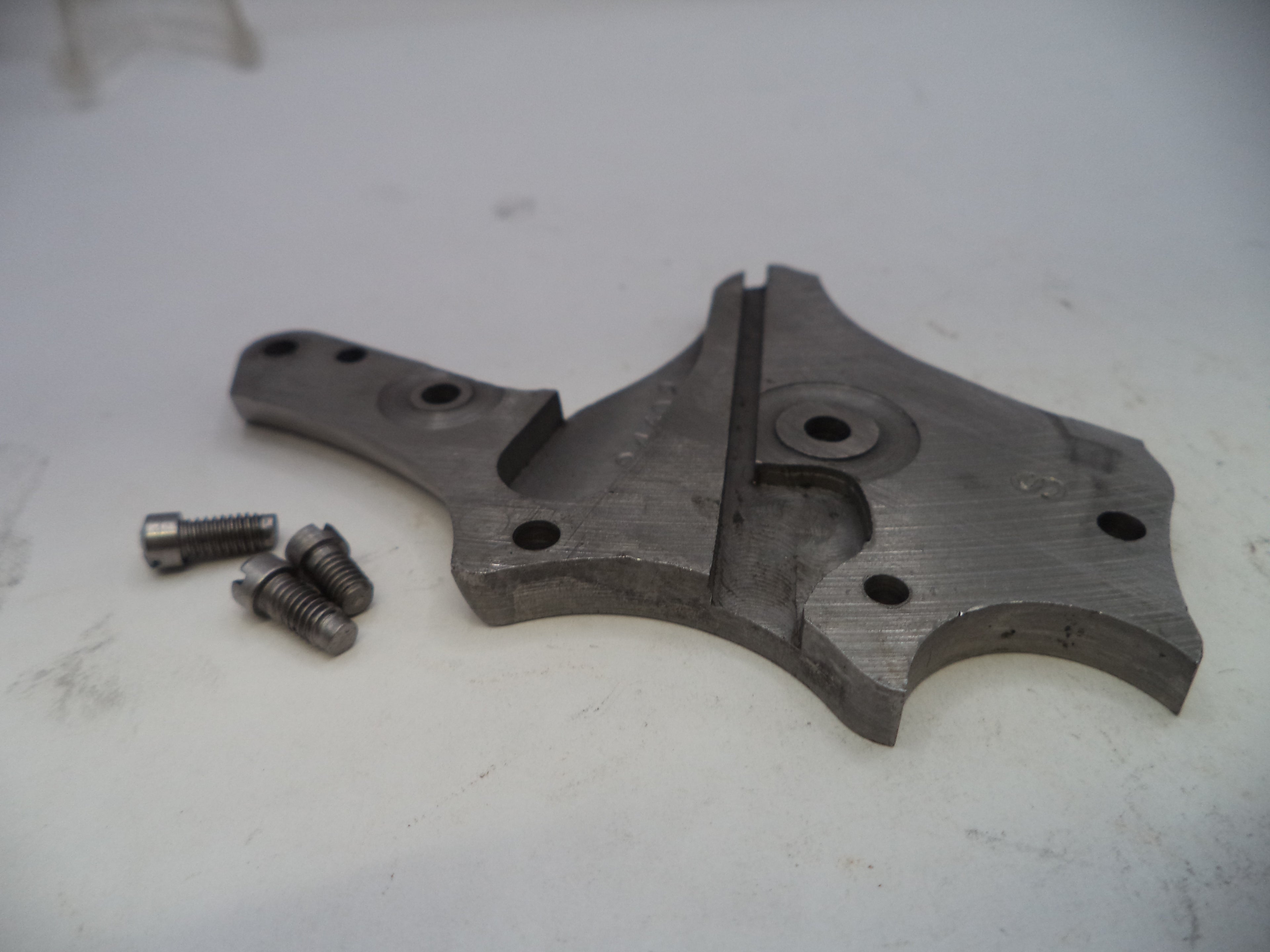 Metal mechanical component with screws on a white background