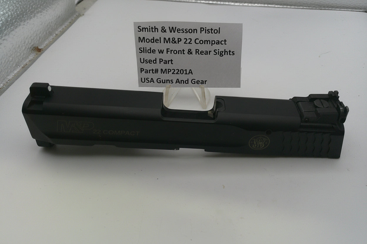 Smith & Wesson pistol slide on a white background with a label.