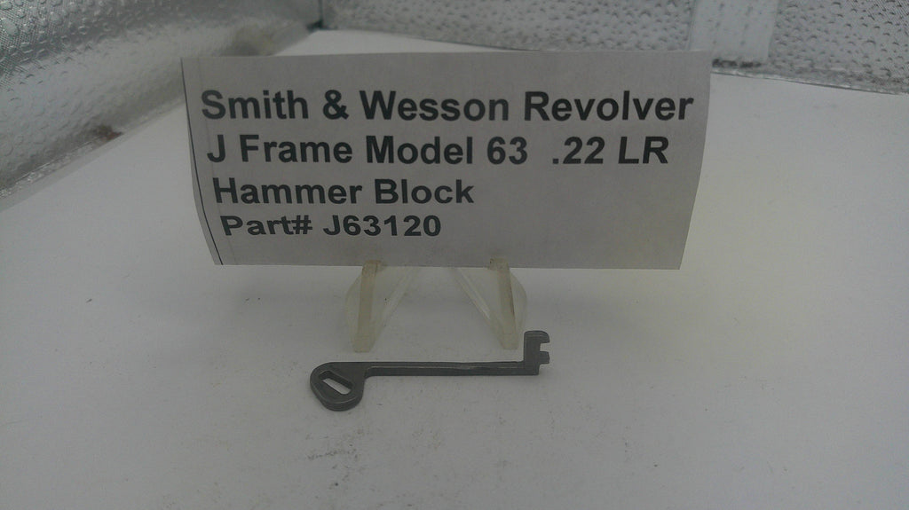 Smith & Wesson Revolver J Frame Model 63 .22 LR Hammer Block on a white surface with a label.