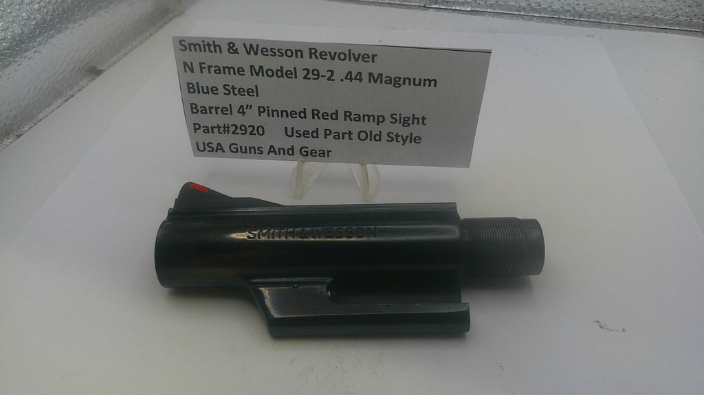 Smith & Wesson revolver on a white surface with a label detailing specifications.