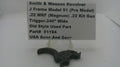 A used black metal Smith & Wesson revolver trigger component displayed on a clear plastic stand with a white paper label card. The label reads 'Smith & Wesson Revolver J Frame Model 51 (Pre Model) .