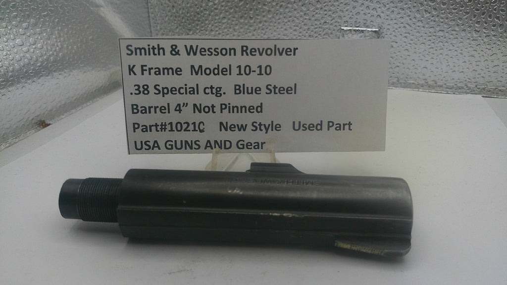 Smith & Wesson revolver barrel on a white surface with a label detailing specifications.