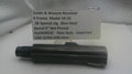 Smith & Wesson revolver barrel on a white surface with a label detailing specifications.
