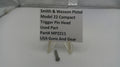 Smith & Wesson pistol trigger pin head on a stand with a label
