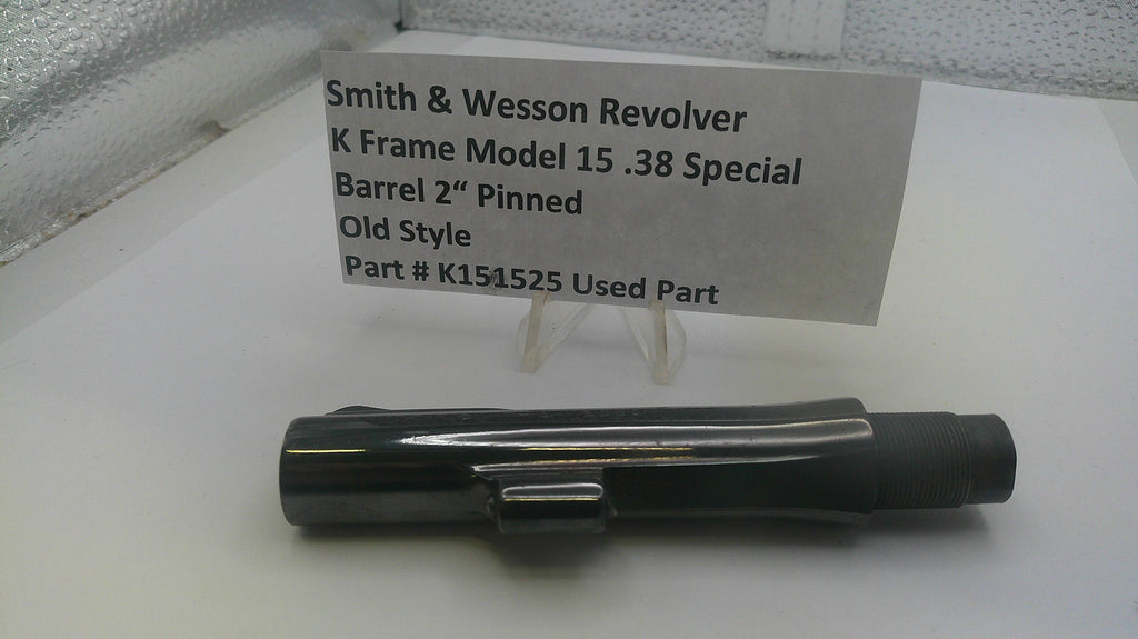 Smith & Wesson revolver part on a white surface with a label
