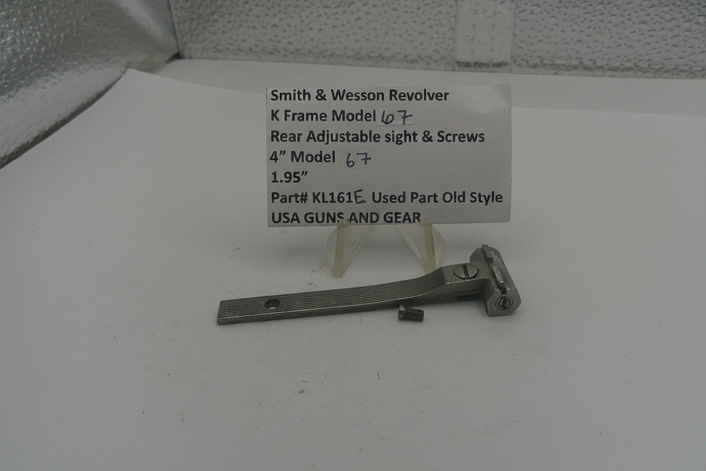 Smith & Wesson revolver K Frame Model sight and screws on a white surface with a label.