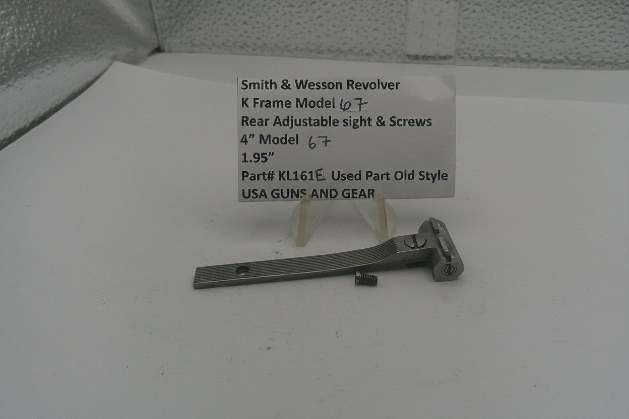 Smith & Wesson revolver K Frame Model sight and screws on a white surface with a label.