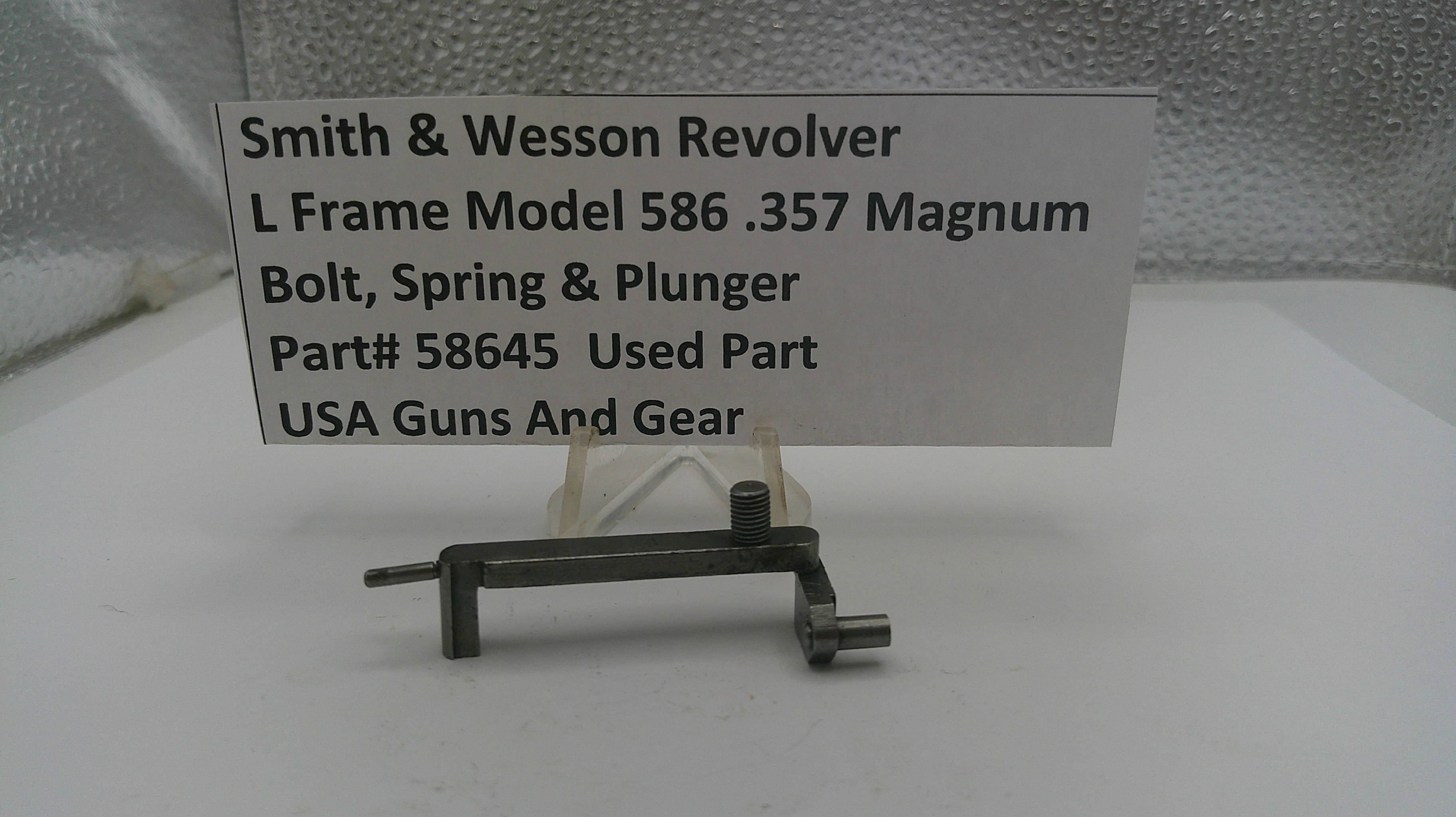 Used Smith & Wesson Revolver L Frame Model 586 .357 Magnum bolt, spring, and plunger on a white background with a label.