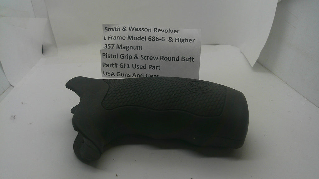 A black Smith & Wesson revolver pistol grip and screw butt part, shown inside a white box next to a white paper label with product details.