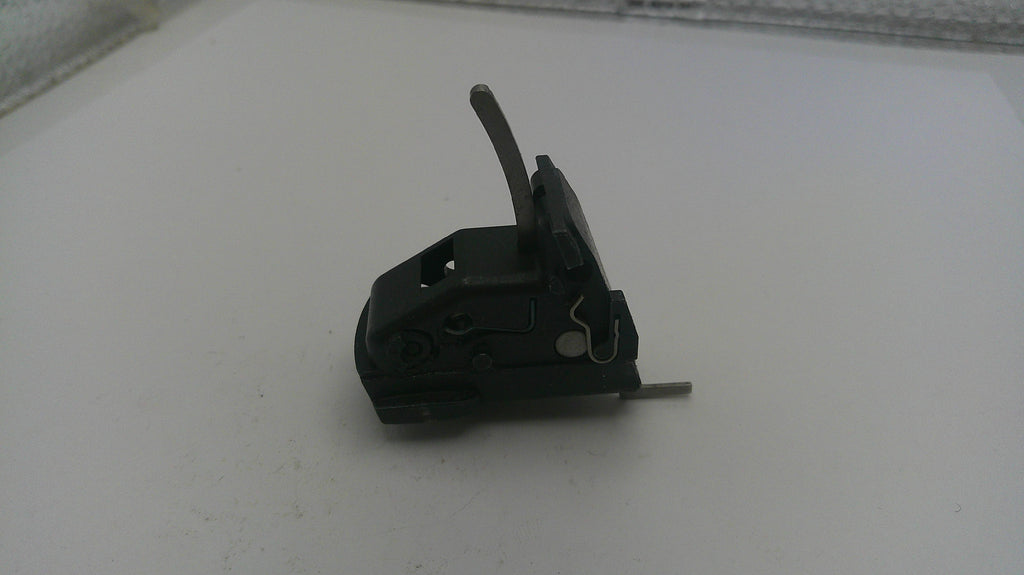 Small mechanical component on a white surface