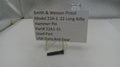 Smith & Wesson Pistol Hammer Pin on a stand with a label indicating part number and source.