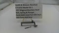 Smith & Wesson revolver component with descriptive card on a white background