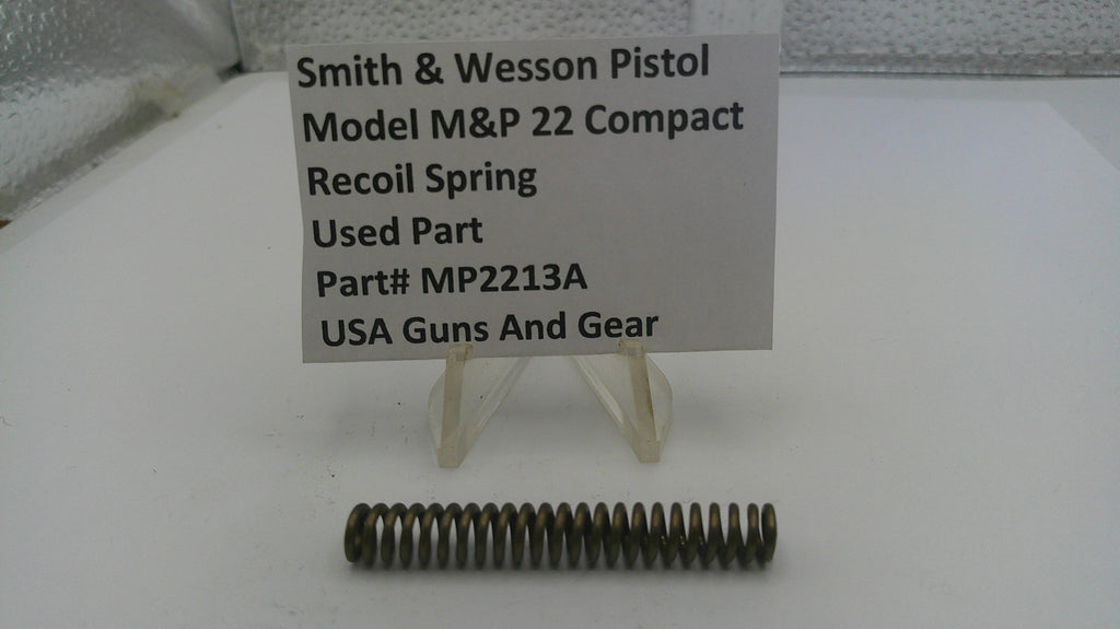Smith & Wesson pistol recoil spring with a label on a white background