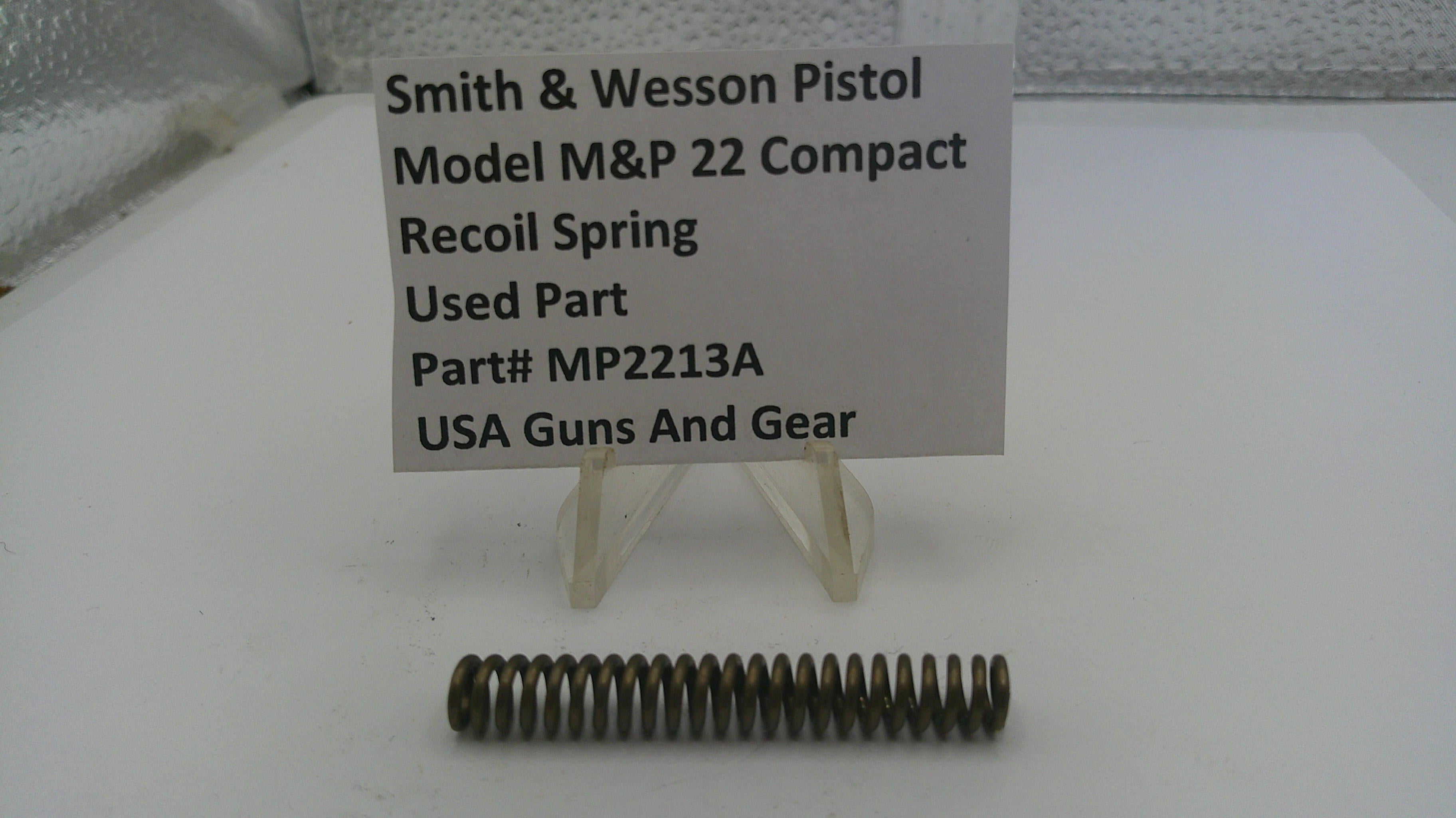 Smith & Wesson pistol recoil spring with a label on a white background