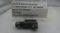 Smith & Wesson revolver barrel with descriptive label on a white surface