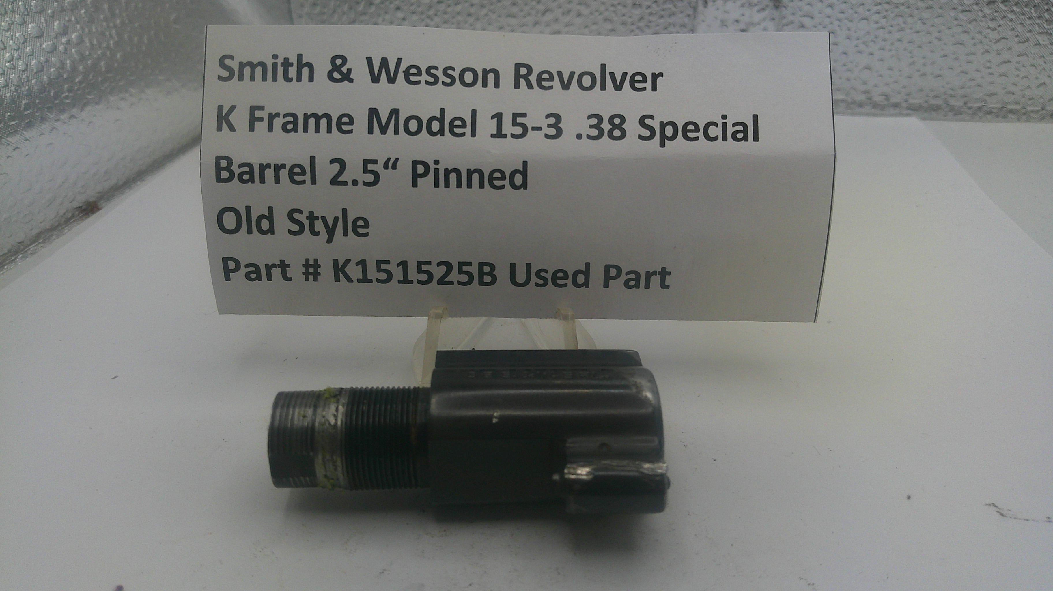 Smith & Wesson revolver barrel with descriptive label on a white surface
