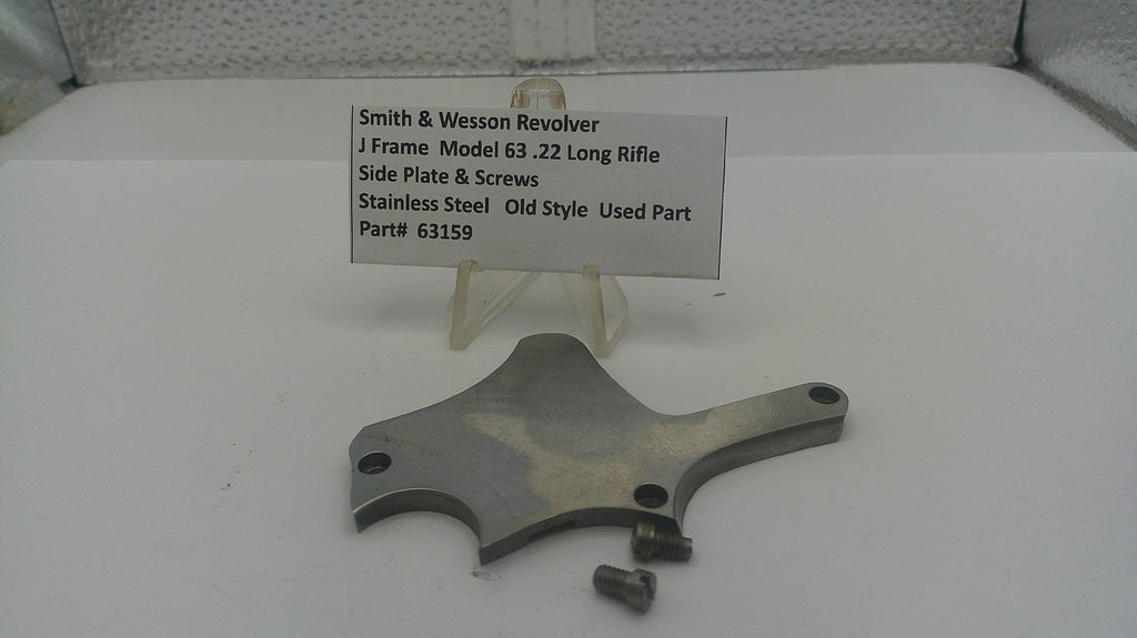 Metal component with a label on a white surface
