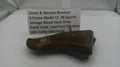 Smith & Wesson revolver grip with descriptive label on a white surface