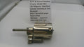 Smith & Wesson revolver cylinder assembly on a white surface with a label.
