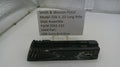 Smith & Wesson pistol slide assembly with a label on a white surface