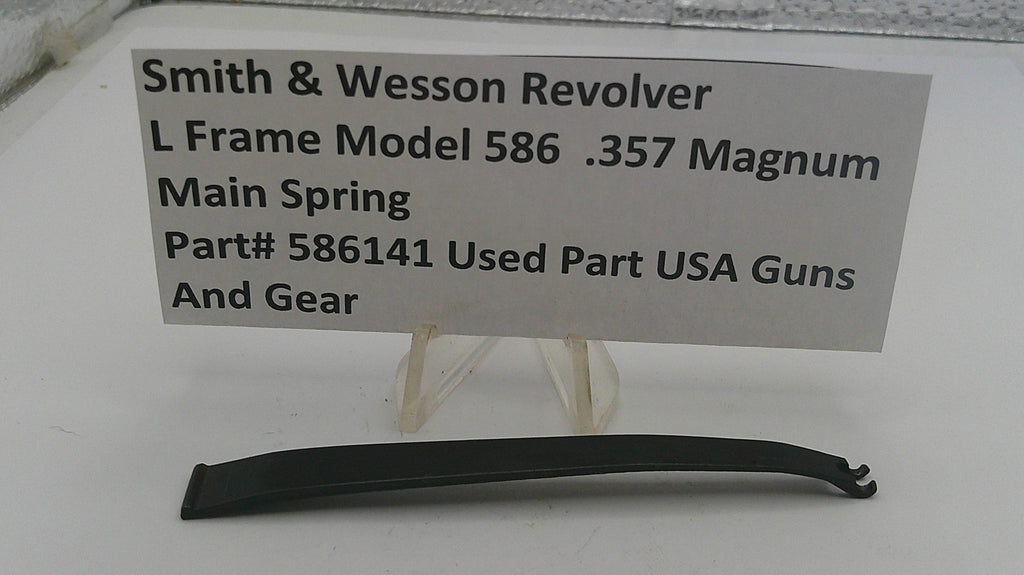 Smith & Wesson revolver main spring with a label on a white background