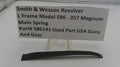 Smith & Wesson revolver main spring with a label on a white background