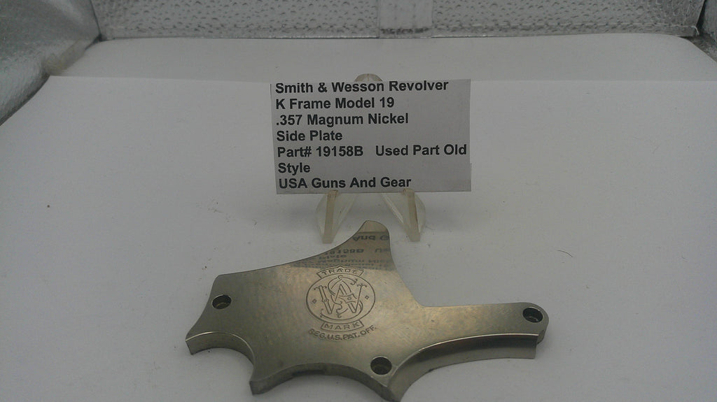 Smith & Wesson revolver part on a white surface with a label