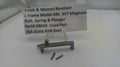 Smith & Wesson revolver parts on a white surface with a label.
