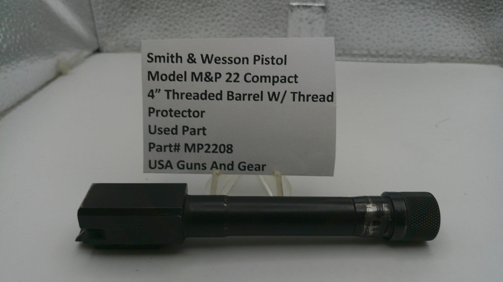 Smith & Wesson pistol barrel with a label on a white background