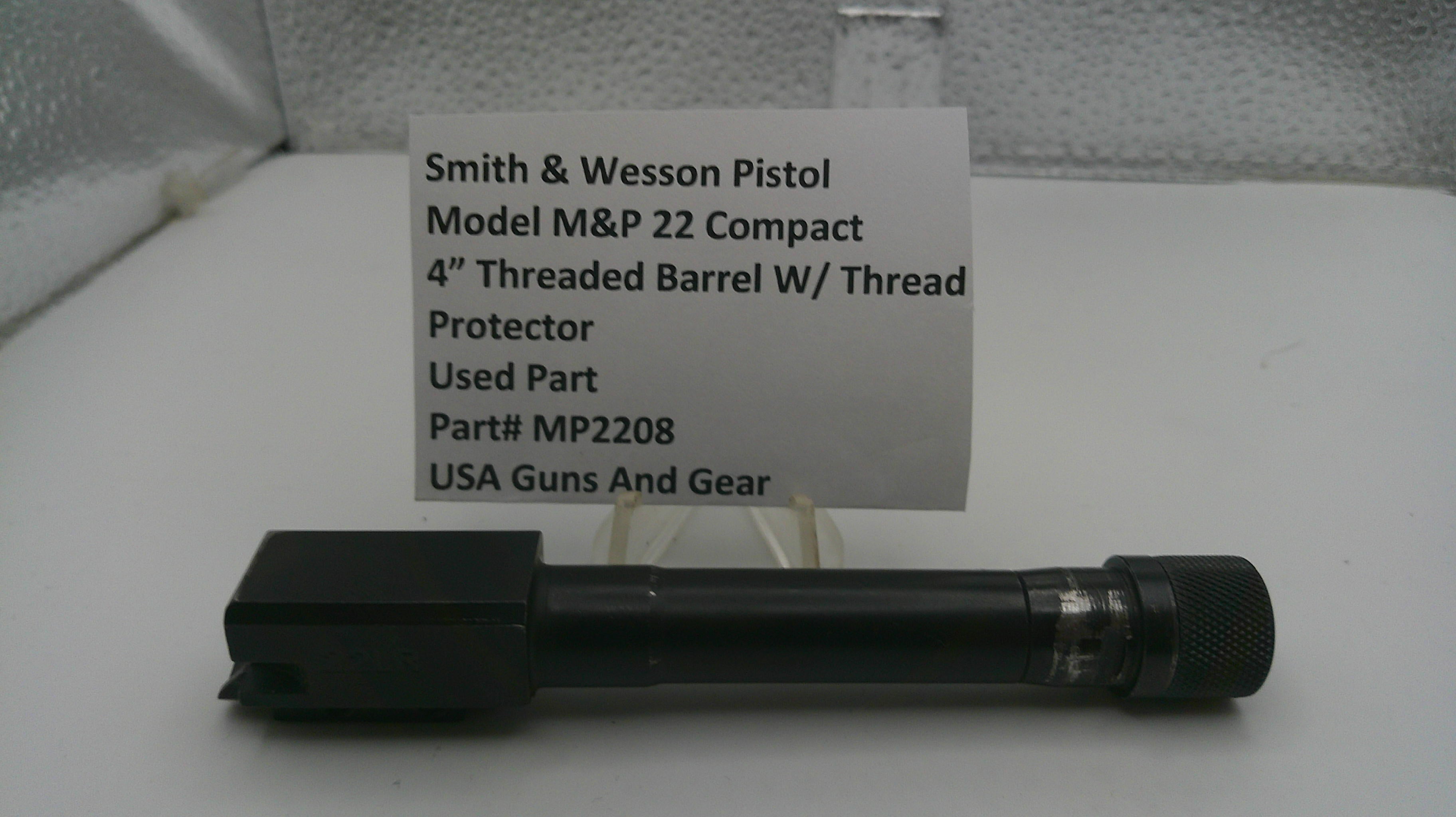 Smith & Wesson pistol barrel with a label on a white background