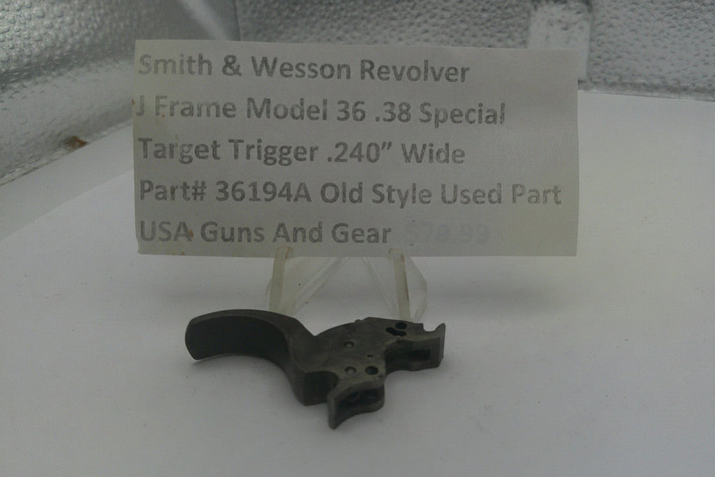 Smith & Wesson revolver part on a stand with a label detailing specifications.