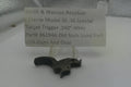 Smith & Wesson revolver part on a stand with a label detailing specifications.