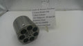A stainless steel 7-cylinder revolver cylinder holder, shown next to a white label card identifying it as a Smith & Wesson revolver part.