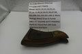 Brown gun holster with a sign detailing compatibility information on a white surface.