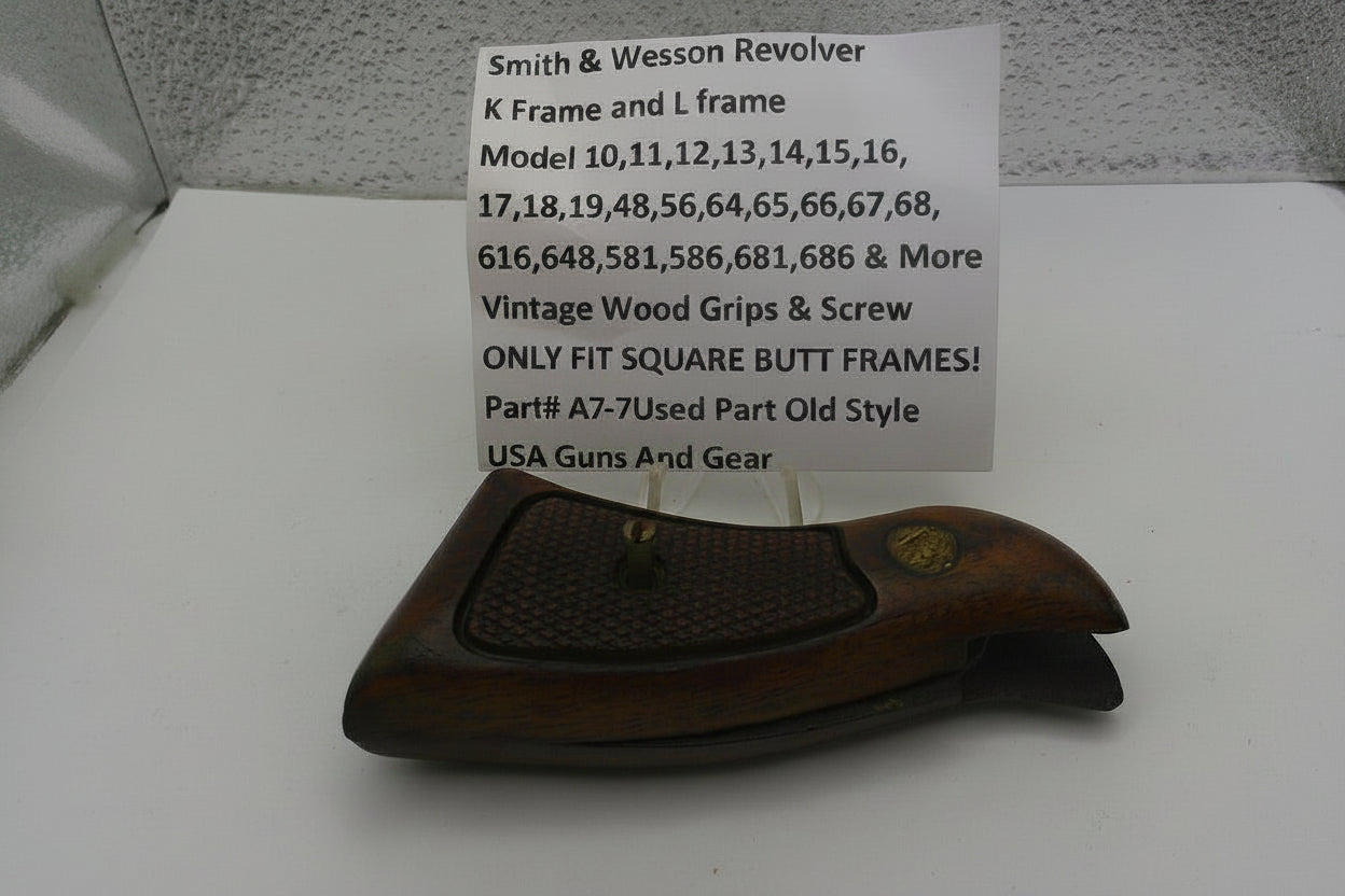 Brown gun holster with a sign detailing compatibility information on a white surface.