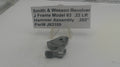 Smith & Wesson revolver hammer assembly with a label on a white background