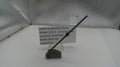 Smith & Wesson pistol hammer assembly on a white surface with a label.