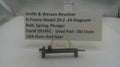 Smith & Wesson revolver part on a stand with a label