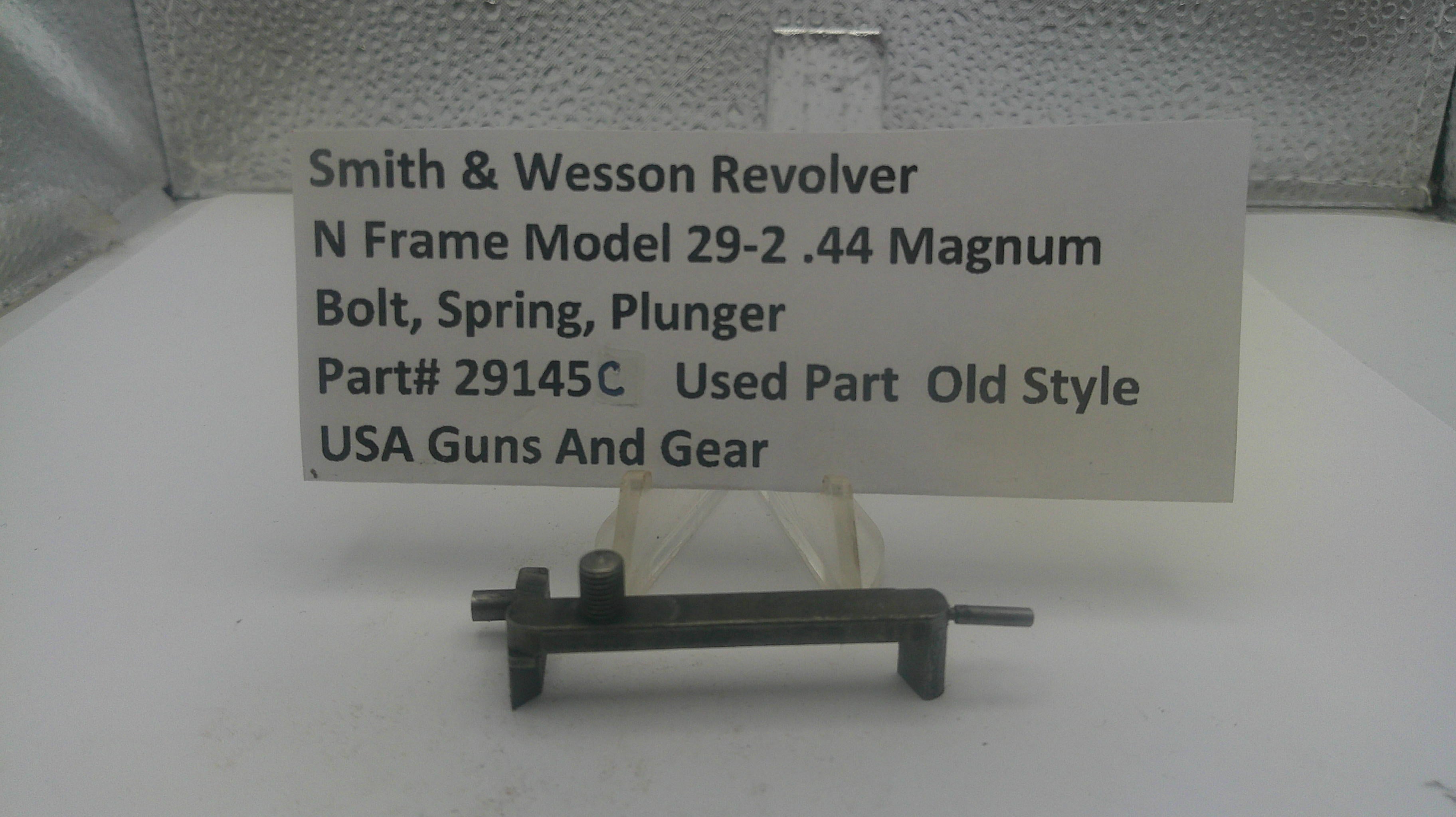 Smith & Wesson revolver part on a stand with a label