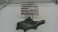 A used black metal Smith & Wesson revolver side plate part, displayed on a clear plastic stand with a white label card identifying the part number and manufacturer.