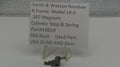 Smith & Wesson revolver part with descriptive label on a white background