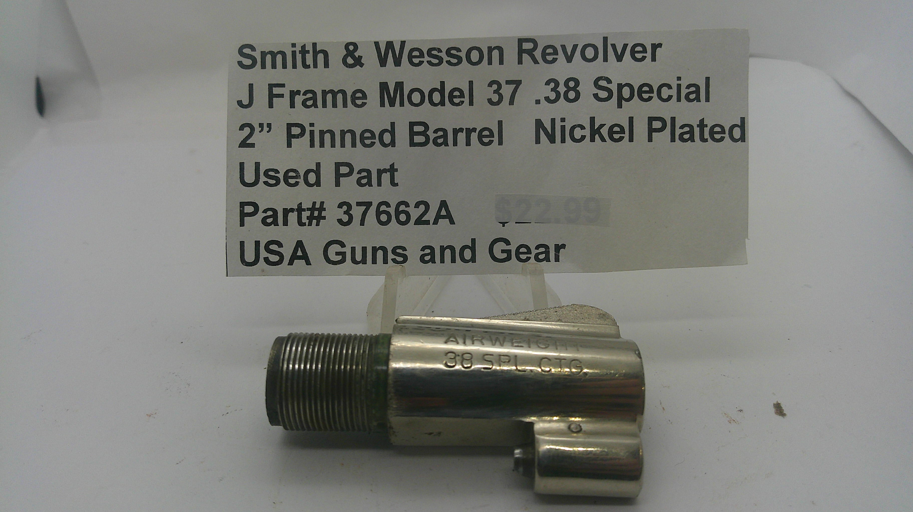 A used nickel-plated metal revolver barrel pinch block for a Smith & Wesson J Frame Model 37 .38 Special, with a handwritten price tag card above it on a white background.