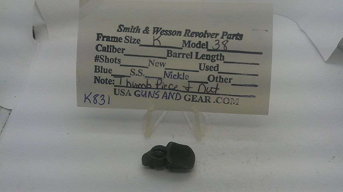 Smith & Wesson used blued thumb piece and nut, inventory reference K831, with identification card; fitment unverified