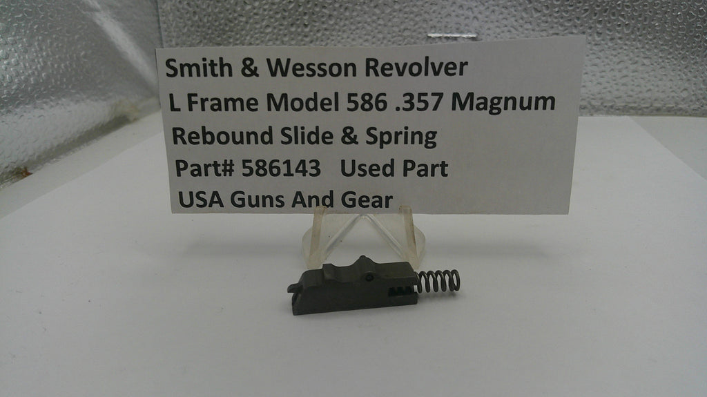 Smith & Wesson revolver part on a white surface with a label