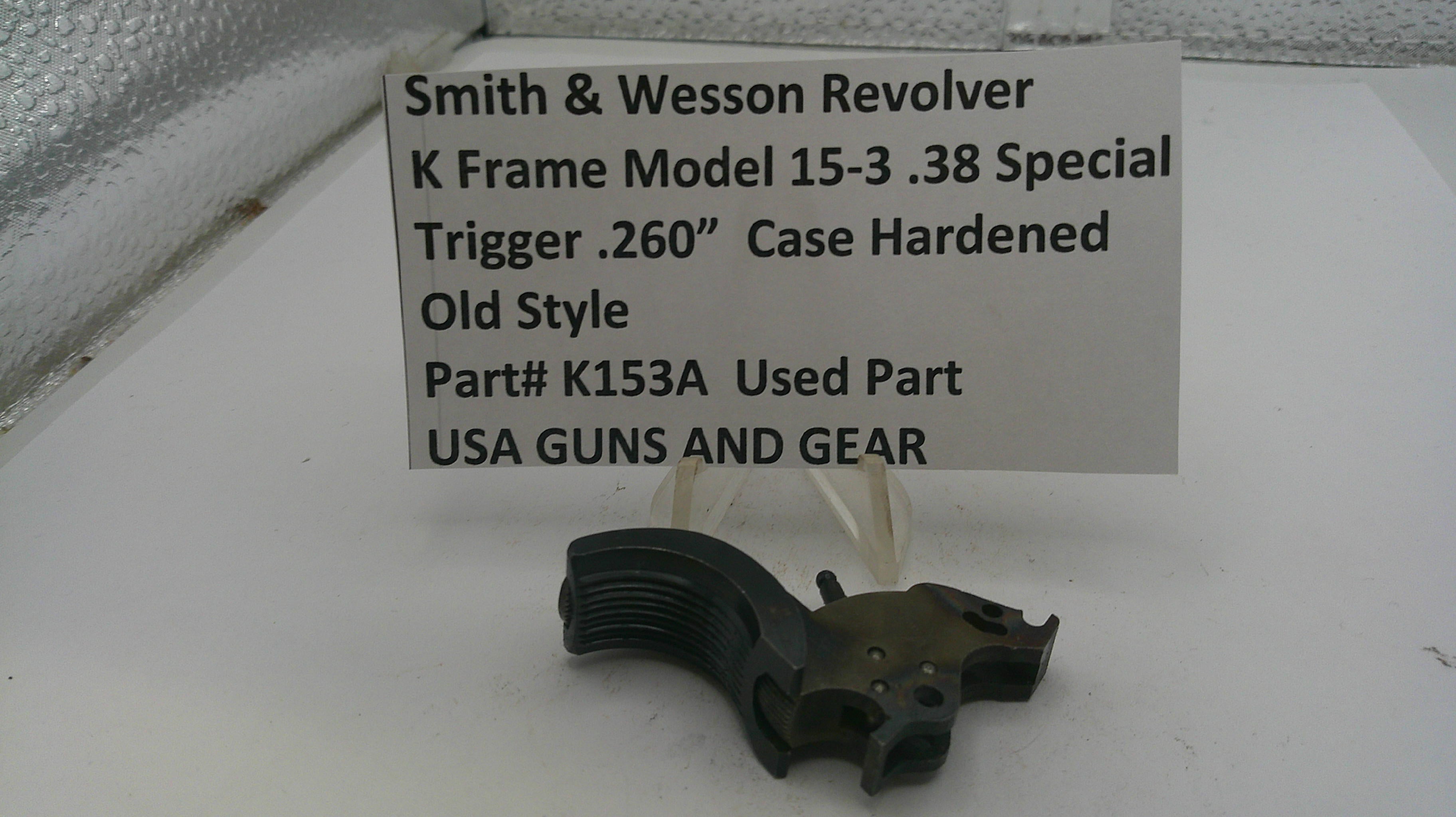 Smith & Wesson revolver part on a white surface with a label detailing specifications.