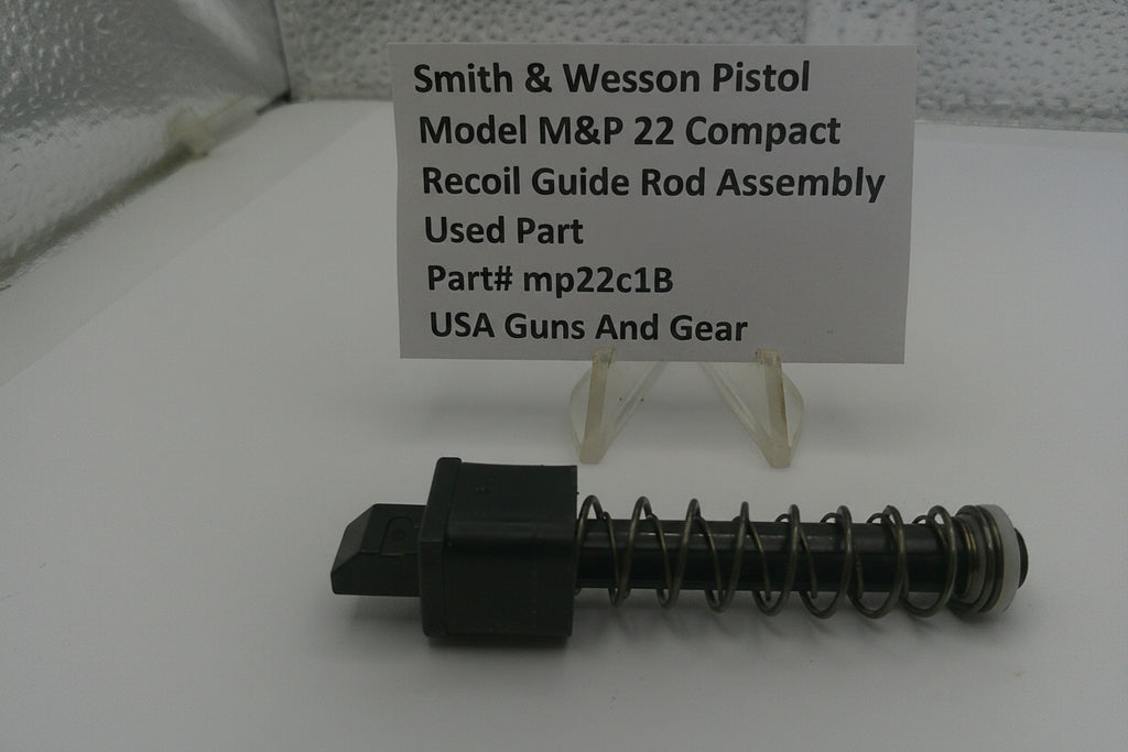 Smith & Wesson pistol recoil guide rod assembly with a label on a white surface